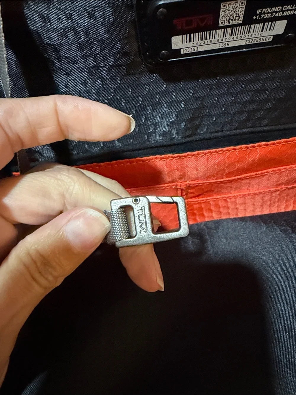 Tumi Red and Black Men/Women’s Backpack with Multiple Front Pockets